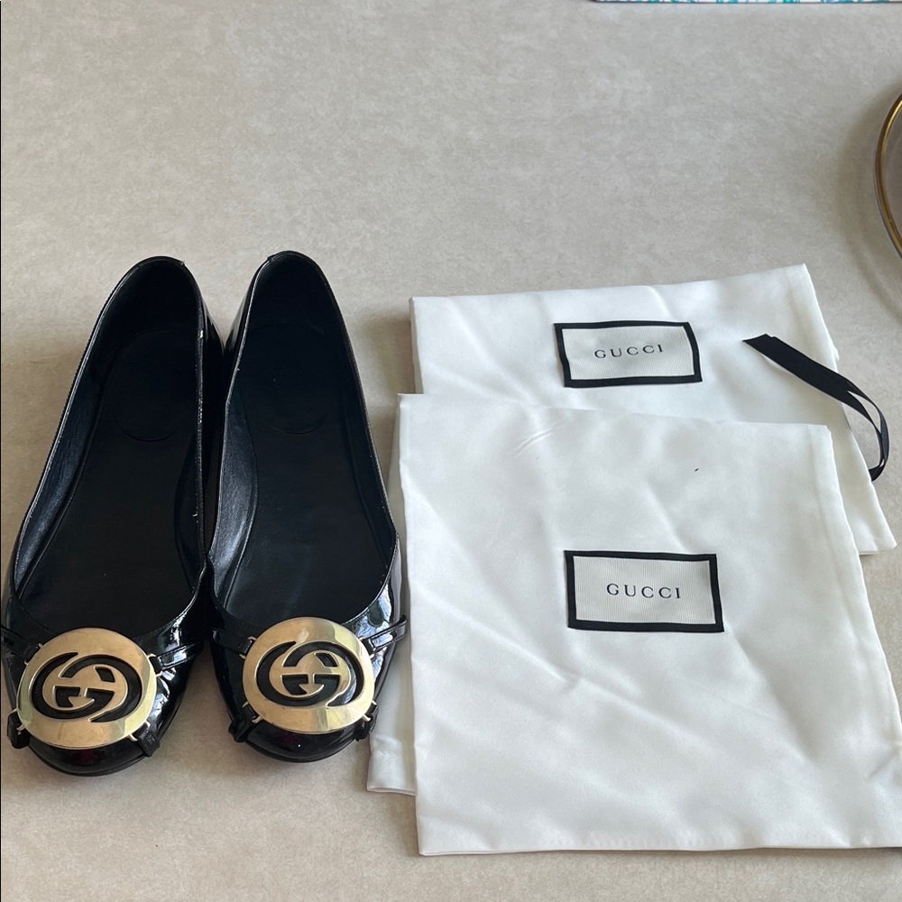 Gucci Black Loafers with Gold Emblem
